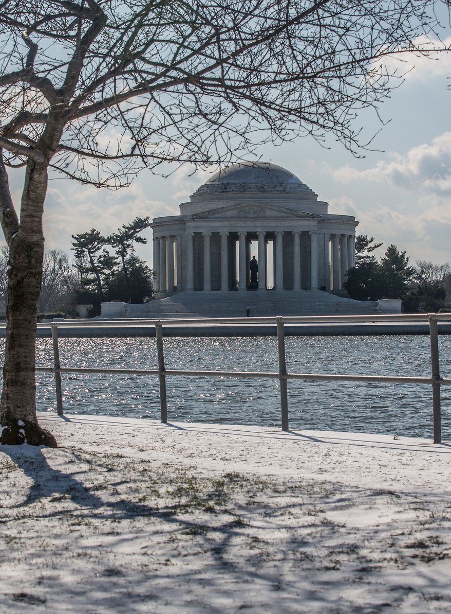 The Jefferson Memorial attracts a few brave souls who venture out during the first snow fall of the year, in Washington, D.C., Thursday, Jan. 24, 2013. (Andrew S. Geraci/The Washington Times)