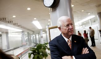 **FILE** Senate Intelligence Committee Vice Chairman Sen. Saxby Chambliss, Georgia Republican, waits to speak with reporters on Capitol Hill in Washington on Nov. 16, 2012. (Associated Press)