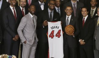 President Obama honors the NBA champions Miami Heat basketball team in the East Room at the White House on Jan. 28, 2013. Pictured in the front row with the president are (from left) Chris Bosh, Dwyane Wade, LeBron James and coach Erik Spoelstra. (Associated Press)