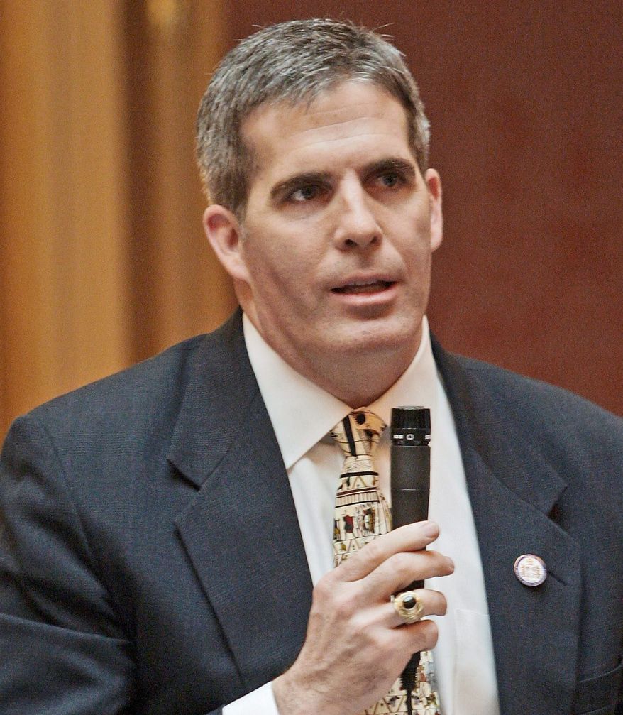 The grading system is a way to get parents "more engaged in the process," says Delegate Thomas A. Greason, Loudouhn Republican. (Associated Press)