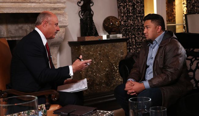 Talk show host Dr. Phil McGraw (left) interviews Ronaiah Tuiasosopo on Jan. 24, 2013, during taping for the &quot;Dr. Phil Show&quot; in Los Angeles. The two-part program, scheduled to air Jan. 31 and Feb. 1, is the first on-air interview of Tuiasosopo, the man who allegedly concocted the girlfriend hoax that ensnared Notre Dame football star Manti Te&#x27;o. (Associated Press/CBS Television Distribution/Peteski Productions)