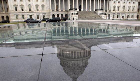 The dome of the Capitol is reflected in a skylight of the Capitol Visitor&#39;s Center in Washington on  Jan. 1, 2013. (Associated Press) ** FILE **