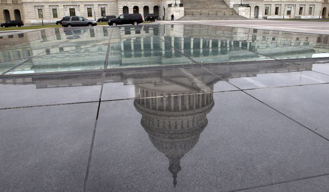 The dome of the Capitol is reflected in a skylight of the Capitol Visitor&#x27;s Center in Washington on  Jan. 1, 2013. (Associated Press) ** FILE **