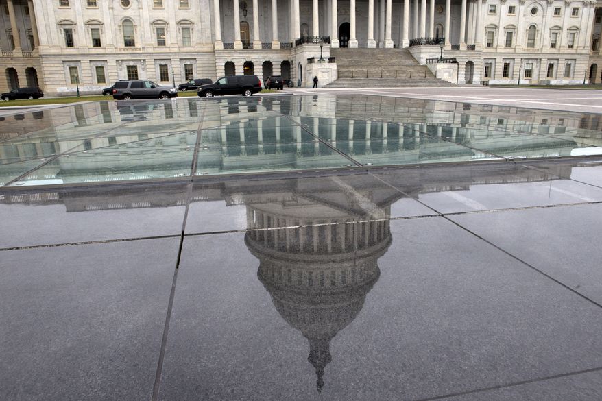 The dome of the Capitol is reflected in a skylight of the Capitol Visitor&#39;s Center in Washington on  Jan. 1, 2013. (Associated Press) ** FILE **
