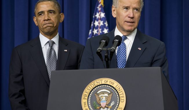 ** FILE ** President Obama listens as Vice President Joseph R. Biden speaks Jan. 16, 2013, at the White House about proposals to reduce gun violence. (Associated Press)