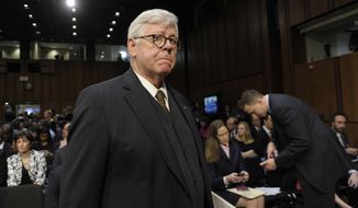 ** FILE ** National Rifle Association President David Keene arrives to attend the Senate Judiciary Committee hearing on gun violence on Capitol Hill in Washington, Wednesday, Jan. 30, 2013. (AP Photo/Susan Walsh)

