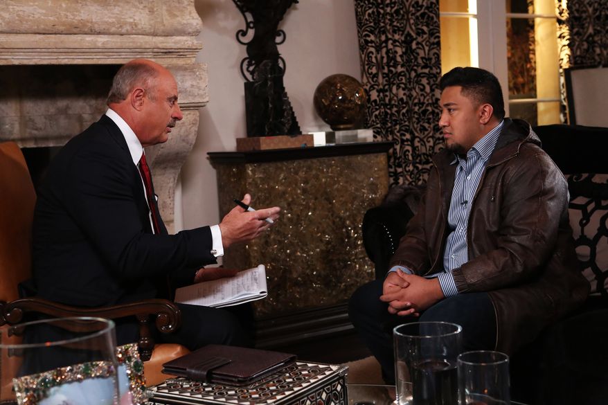 In this Jan. 24, 2013, photo provided by CBS Television Distribution/Peteski Productions, talk show host Dr. Phil McGraw, left, interviews Ronaiah Tuiasosopo during taping for the "Dr. Phil Show" in Los Angeles. The program, scheduled to air Thursday, Jan. 31, and Friday, Feb. 1, will show the first on-air interview of Tuiasosopo, the man who allegedly concocted the girlfriend hoax that ensnared Notre Dame football star Manti Te'o. (AP Photo/CBS Television Distribution/Peteski Productions)