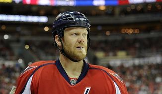 Washington Capitals defenseman John Erskine (4) looks on during the second period of an NHL hockey game against the Buffalo Sabres, Sunday, Jan. 27, 2013, in Washington. (AP Photo/Nick Wass)