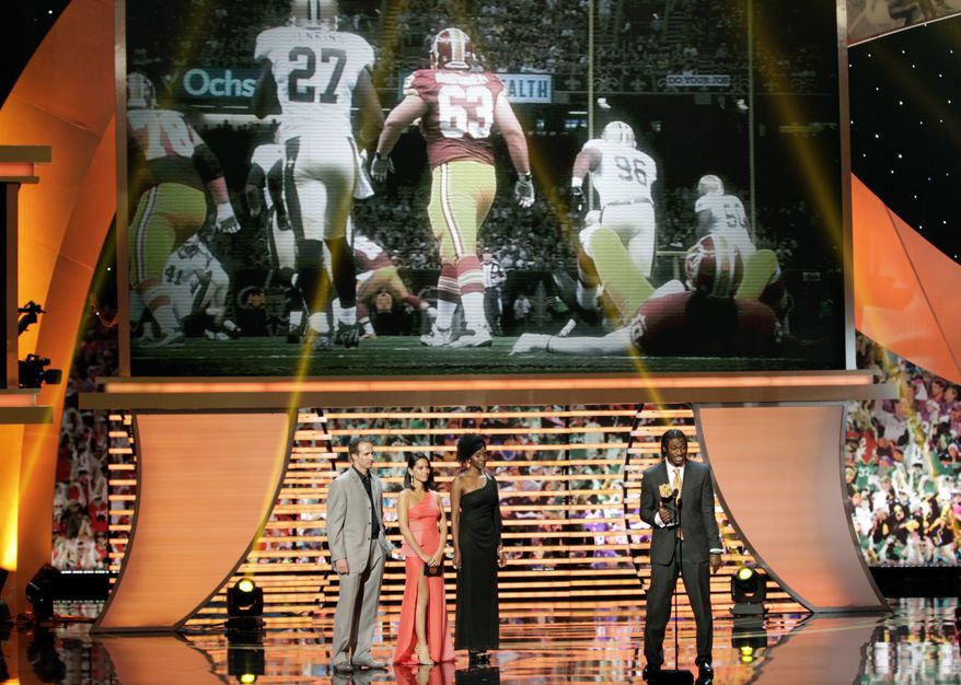 Robert Griffin III of the Washington Redskins accepts the award for AP Offensive Rookie of the Year presented by Pepsi Max at the 2nd Annual NFL Honors on Saturday, Feb. 2, 2013 in New Orleans. (Photo by AJ Mast/Invision/AP)