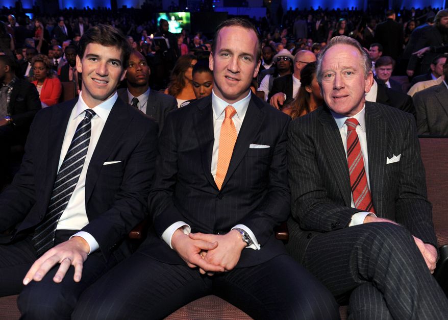 Eli Manning of the New York Giants, left, Peyton Manning of the Denver Broncos, center, and former NFL player Archie Manning at the 2nd Annual NFL Honors on Saturday, Feb. 2, 2013 in New Orleans. (Photo by Jordan Strauss/Invision/AP)