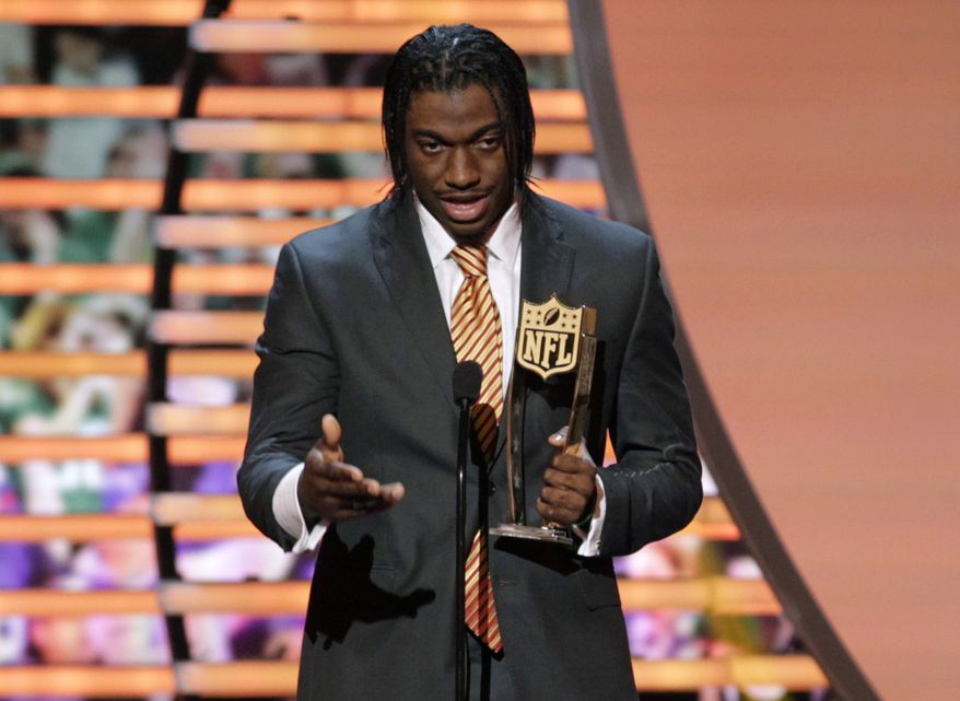 Robert Griffin III of the Washington Redskins accepts the award for AP Offensive Rookie of the Year presented by Pepsi Max at the 2nd Annual NFL Honors on Saturday, Feb. 2, 2013 in New Orleans. (Photo by AJ Mast/Invision/AP)