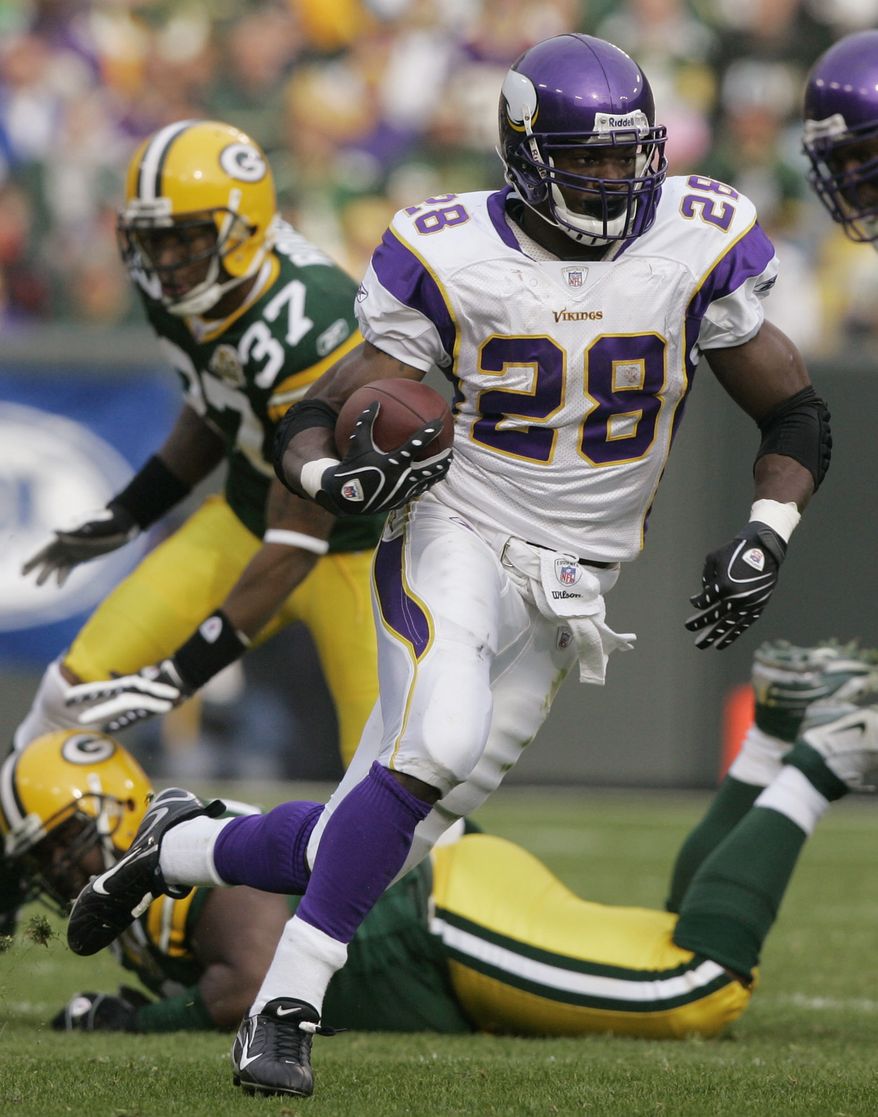 FILE - In this file photo, Minnesota Vikings running back Adrian Peterson (28) moves the ball during the first half of an NFL football game against the Green Bay Packers in Green Bay, Wis. Peterson has won The Associated Press 2012 NFL Offensive Player of the Year award just one year after major knee surgery. (AP Photo/Morry Gash, File)