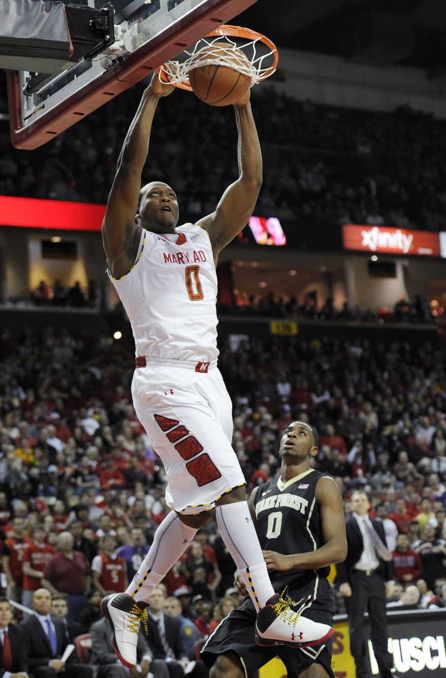 Maryland forward Charles Mitchell dunks over Wake Forest guard Codi Miller-McIntyre, right, during the second half of an NCAA college basketball game, Saturday, Feb. 2, 2013, in College Park, Md. Maryland won 86-60. (AP Photo/Nick Wass)
