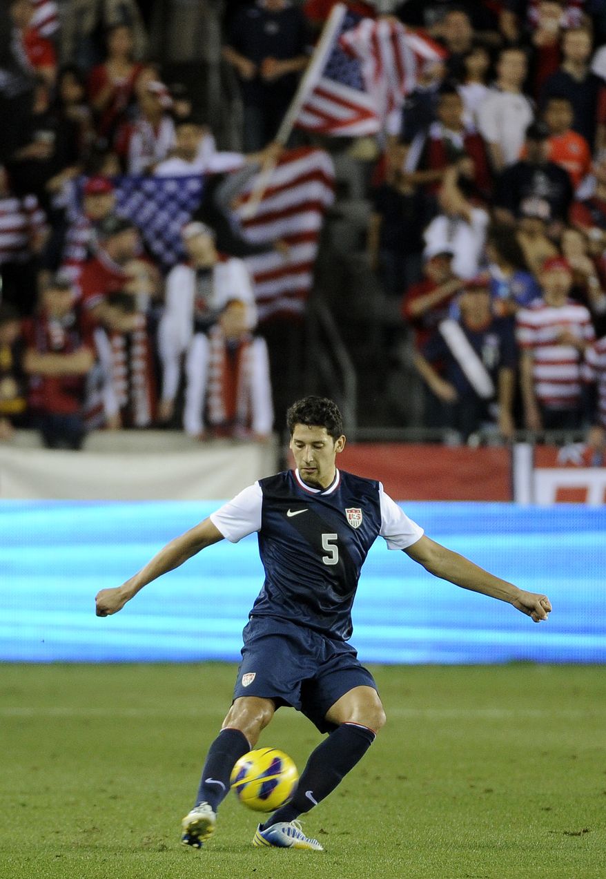 U.S. national team's Omar Gonzalez kicks the ball in the first half of an exhibition game against Canada Tuesday, Jan. 29, 2013, in Houston. (AP Photo/Pat Sullivan)
