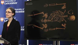 Jo Appleby, a lecturer in Human Bioarchaeology, at University of Leicester, School of Archaeology and Ancient History, who led the exhumation of the remains found during a dig at a Leicester car park, speaks at the university Monday, Feb. 4, 2013. Tests have established that a skeleton found, pictured behind, are &quot;beyond reasonable doubt&quot; the long lost remains of England&#39;s King Richard III, missing for 500 years. (AP Photo/Rui Vieira, PA)