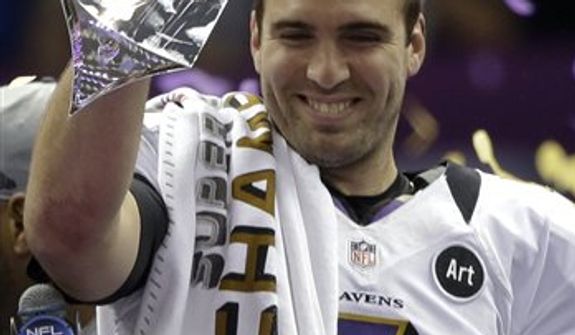 Baltimore Ravens quarterback Joe Flacco holds up the Vince Lombardi Trophy after their 34-31 win against the San Francisco 49ers in the NFL Super Bowl XLVII football game Sunday, Feb. 3, 2013, in New Orleans. (AP Photo/Marcio Sanchez) 
