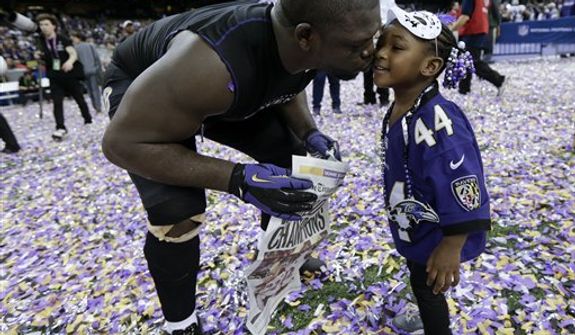 Baltimore Ravens fullback Vonta Leach celebrates with his daughter Giselle after their 34-31 win against the San Francisco 49ers in the NFL Super Bowl XLVII football game, Sunday, Feb. 3, 2013, in New Orleans. (AP Photo/Marcio Sanchez) 