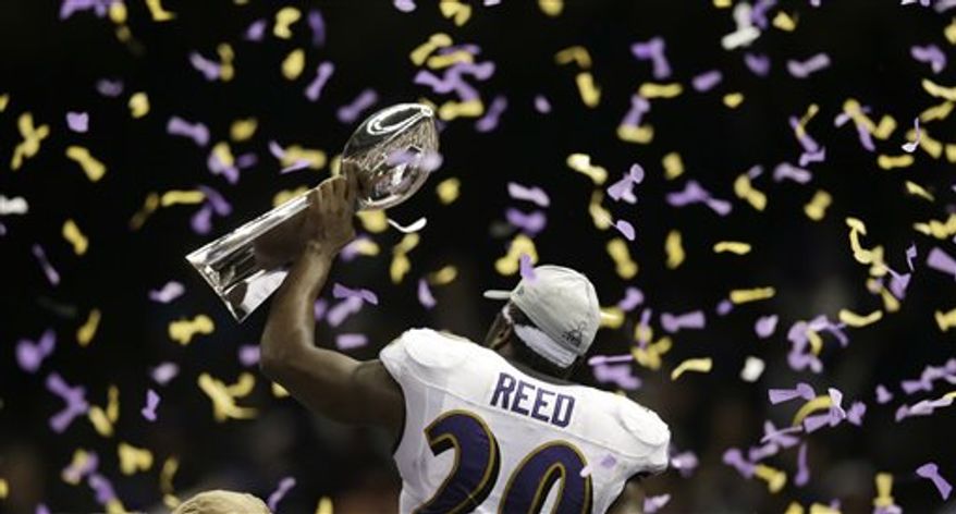 Baltimore Ravens safety Ed Reed (20) holds the Vince Lombardi Trophy after defeating the San Francisco 49ers 34-31 in the NFL Super Bowl XLVII football game, Sunday, Feb. 3, 2013, in New Orleans. (AP Photo/Evan Vucci)