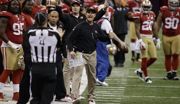 San Francisco 49ers head coach Jim Harbaugh argues with field judge Craig Wrolstad during the second half of the NFL Super Bowl XLVII football game Sunday, Feb. 3, 2013, in New Orleans. (AP Photo/Gene Puskar) 