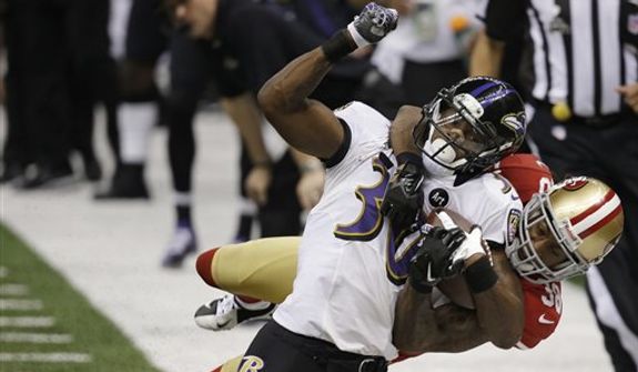 San Francisco 49ers safety Dashon Goldson (38) tackles Baltimore Ravens running back Bernard Pierce (30) during the second half of the NFL Super Bowl XLVII football game, Sunday, Feb. 3, 2013, in New Orleans. (AP Photo/Elaine Thompson) 