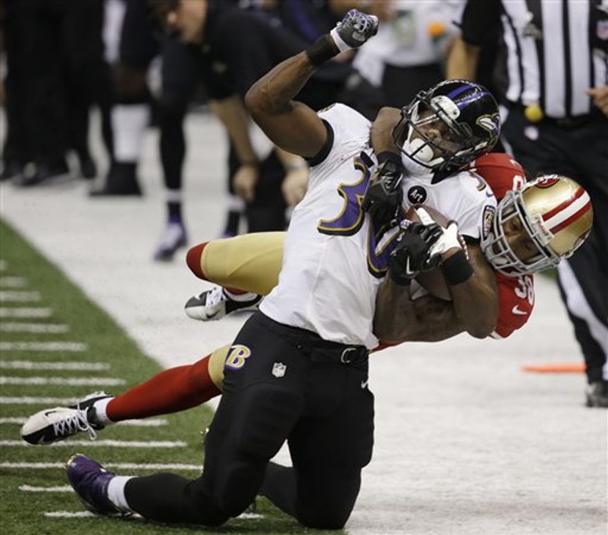 San Francisco 49ers safety Dashon Goldson (38) tackles Baltimore Ravens running back Bernard Pierce (30) during the second half of the NFL Super Bowl XLVII football game, Sunday, Feb. 3, 2013, in New Orleans. (AP Photo/Elaine Thompson)