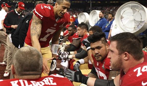 San Francisco 49ers quarterback Colin Kaepernick (7) shakes hands with offensive lineman Joe Staley (74) during the second half of the NFL Super Bowl XLVII football game against the Baltimore Ravens, Sunday, Feb. 3, 2013, in New Orleans. (AP Photo/Evan Vucci)