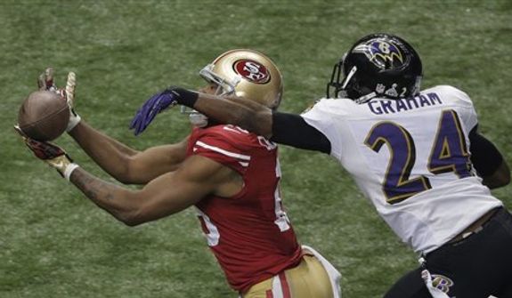 San Francisco 49ers wide receiver Michael Crabtree (15) cannot make the reception as Baltimore Ravens cornerback Corey Graham (24) defends during the second half of the NFL Super Bowl XLVII football game, Sunday, Feb. 3, 2013, in New Orleans.  (AP Photo/Charlie Riedel) 
