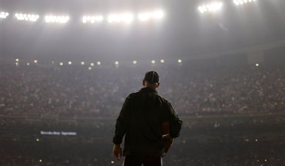 An official looks on during a Superdome power outage in the second half of the NFL Super Bowl XLVII football game between the San Francisco 49ers and the Baltimore Ravens, Sunday, Feb. 3, 2013, in New Orleans. (AP Photo/David Goldman)