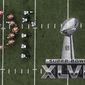 Players line up on the field during the first half of the NFL Super Bowl XLVII football game between the San Francisco 49ers and the Baltimore Ravens Sunday, Feb. 3, 2013, in New Orleans. (AP Photo/Tim Donnelly) 