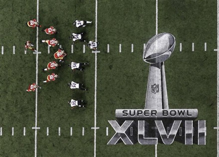 Players line up on the field during the first half of the NFL Super Bowl XLVII football game between the San Francisco 49ers and the Baltimore Ravens Sunday, Feb. 3, 2013, in New Orleans. (AP Photo/Tim Donnelly)