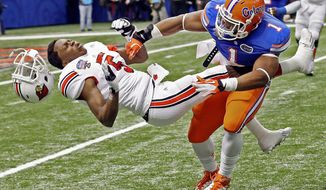 Teddy Bridgewater went on to lead Louisville to one of the biggest upset in BCS bowl history after taking a brutal hit in the Sugar Bowl on Jan. 2. The NCAA scarcely mentions concussions in its manual. (Associated Press)