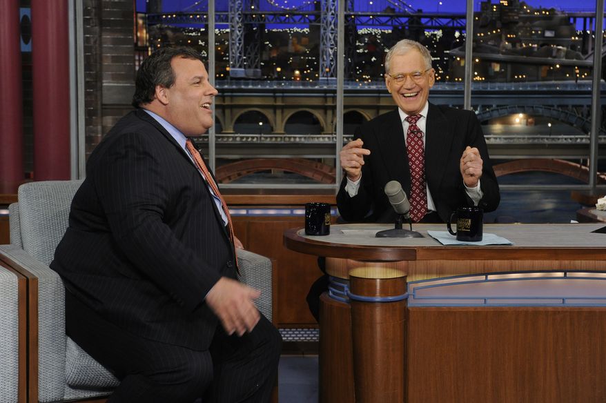 ** FILE ** New Jersey Gov. Chris Christie (left) and late-night host David Letterman react with laughter during the governor's first visit to "Late Show With David Letterman" on Monday, Feb. 4, 2013. (AP Photo/CBS Broadcasting, Jeffrey Neira)