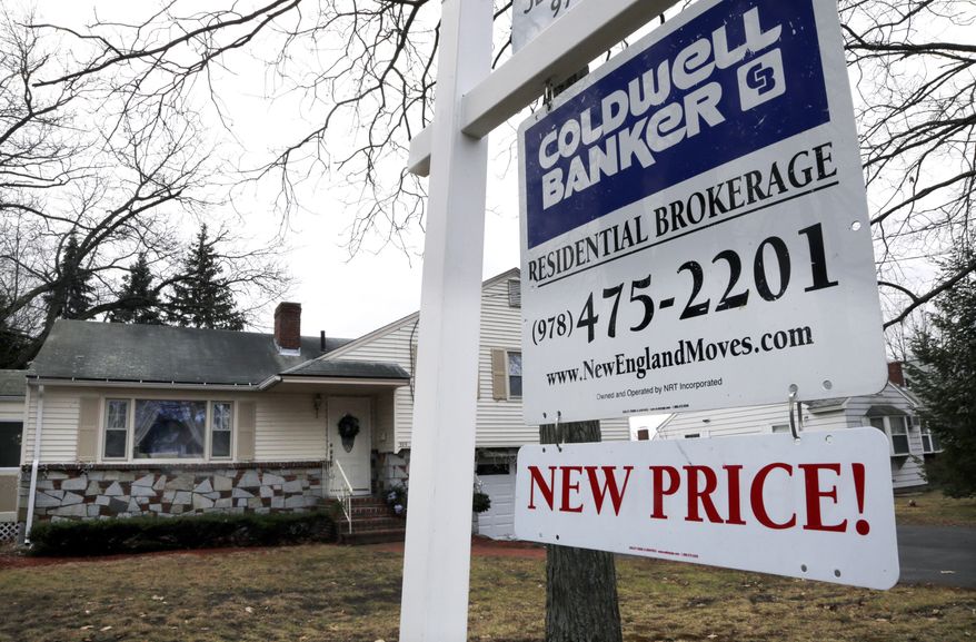 A home is up for sale in North Andover, Mass., on Thursday, Dec. 20, 2012. (AP Photo/Elise Amendola)