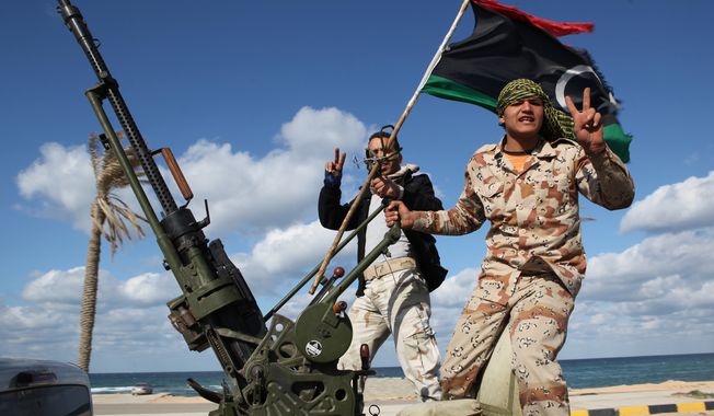 **FILE** Libyan militias from towns throughout the country&#x27;s west parade through Tripoli on Feb. 14, 2012. (Associated Press)