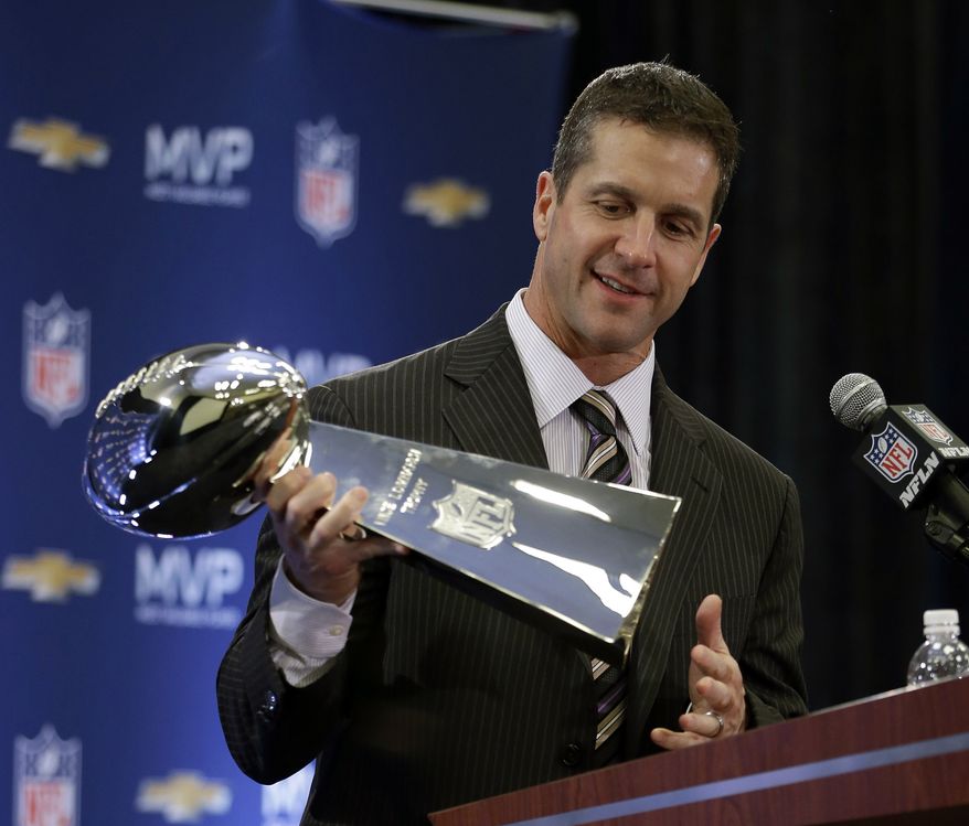 Baltimore Ravens head coach John Harbaugh holds the Vince Lombardi Trophy during a news conference in New Orleans on Feb. 4, 2013, after the Ravens&#x27; 34-31 victory over the San Francisco 49ers in Super Bowl XLVII. (AP Photo/Darron Cummings)