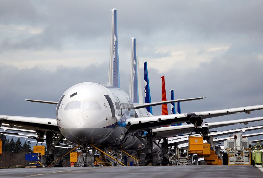 A line of new 787 Dreamliners park nose-to-tail at Paine Field in Everett, Wash., home to Boeing Inc.'s factory. The planes were grounded in January after a battery fire in one and smoke in another. (Associated Press)