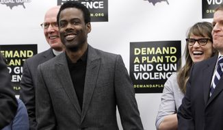 Actor and comedian Chris Rock (left), actress Amanda Peet (right) and others share a laugh during a news conference on Capitol Hill in Washington on Feb. 6, 2013, to call on Congress to act on President Obama&#39;s plan to reduce gun violence. (Associated Press)