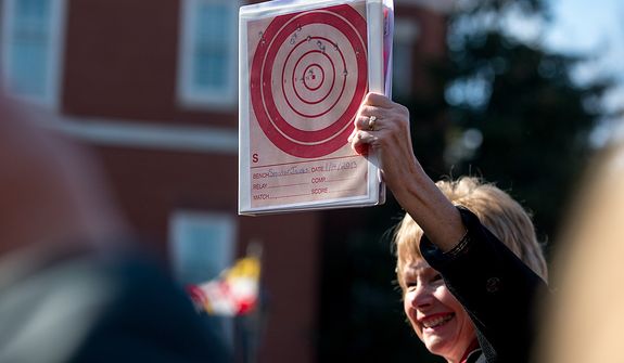 Maryland state Sen. Nancy Jacobs, a Republican, holds up a gun target she shot as she speaks during a pro-gun-rights rally against a proposal by Maryland Gov. Martin O&#39;Malley that would ban so-called assault weapons and require residents to obtain a license before purchasing handguns, at Lawyers Park in front of the Statehouse in Annapolis on Wednesday, Feb. 6, 2013. (Andrew Harnik/The Washington Times)