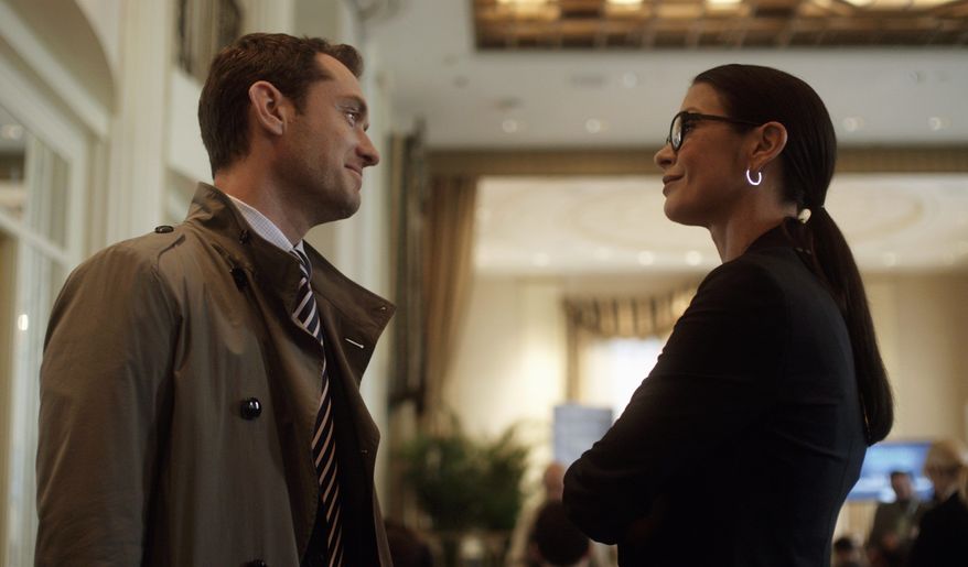 Characters played by Jude Law and Catherine Zeta-Jones attempt to treat a depressed young wife in the intelligent commercial thriller "Side Effects." (Open Road Films via Associated Press)