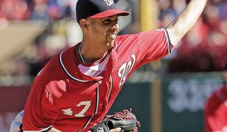 Washington Nationals pitcher Gio Gonzalez throws during the first inning of Game 1 of the National League division baseball series against the St. Louis Cardinals, Sunday, Oct. 7, 2012, in St. Louis. (AP Photo/Charlie Riedel)