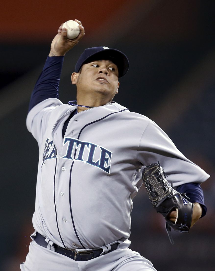 Felix Hernandez throws to a Los Angeles Angels batter during the first inning of a baseball game in Anaheim, Calif., Wednesday, Sept. 26, 2012. (AP Photo/Jae C. Hong)