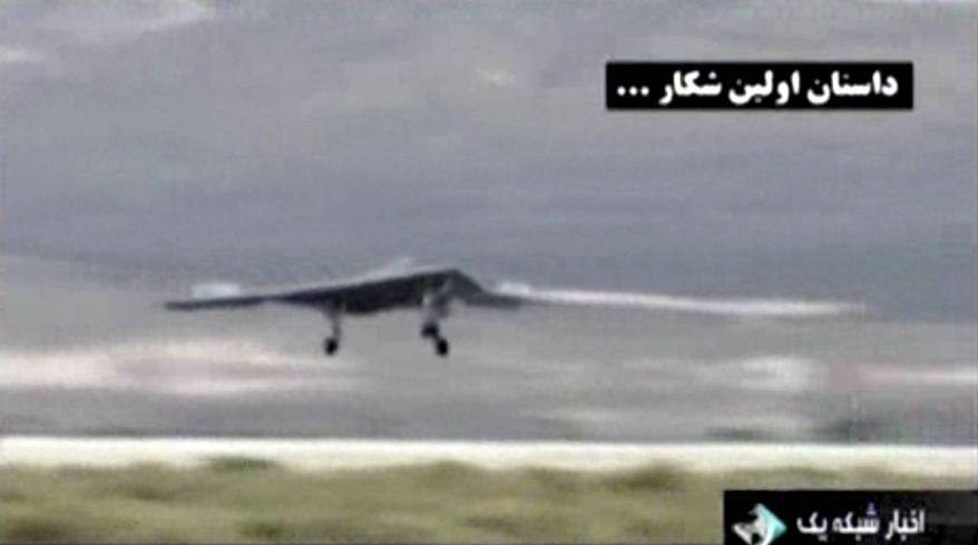 This undated image taken from video broadcast on Iranian state television purports to show a U.S. drone landing in Kandahar, Afghanistan. Iran's state TV has broadcast footage on Thursday, Feb. 7, 2013, allegedly extracted from the advanced CIA spy drone captured in 2011, the latest in a flurry of moves from Iranian authorities meant to underline the nation's purported military and technological advances. (AP Photo/Iranian state TV via AP video)