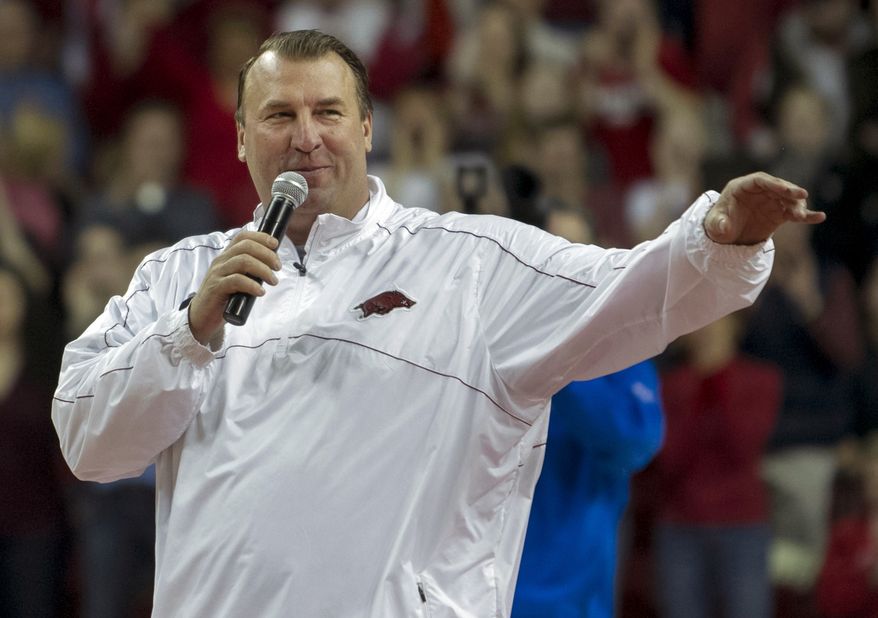 Arkansas head football coach Bret Bielema speaks during a time out in the first half an NCAA college basketball game against Tennessee in Fayetteville, Ark., Saturday, Feb. 2, 2013. Arkansas defeated Tennessee 73-60. (AP Photo/Gareth Patterson)