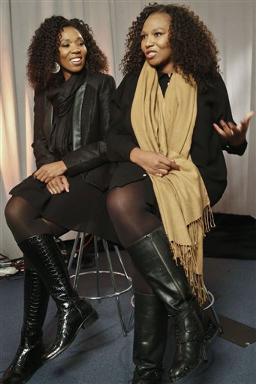 In this Wednesday, Feb. 6, 2013 photo, Swati Dlamini, left, and Zaziwe Dlamini-Manaway, granddaughters of Nelson and Winnie Mandela, speak during an interview in New York. The sisters are stars of the new reality show "Being Mandela," produced by COZI TV for NBC. The 30-minute weekly show premieres on Sunday, Feb. 10 at 9 PM and will follow the next generation of Mandela family through the experiences of sisters Zaziwe and Swati and their families. (AP Photo/Bebeto Matthews)