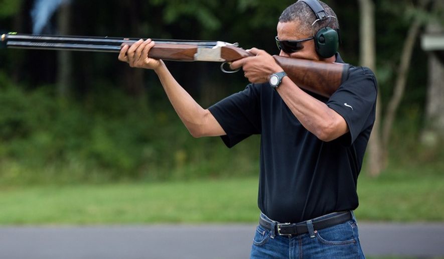 Official White House photo of President Obama shooting a shotgun on Aug. 4, 2012. 
