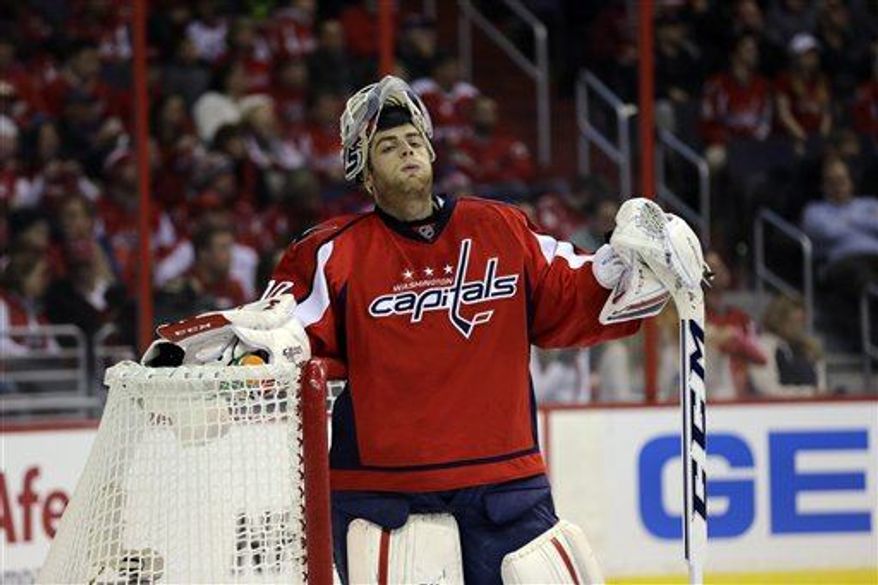 ** File ** Washington Capitals goalie Braden Holtby (70) pauses in the third period of an NHL hockey game against the Winnipeg Jets Tuesday, Jan. 22 in Washington. The Jets won 4-2. (Associated Press)