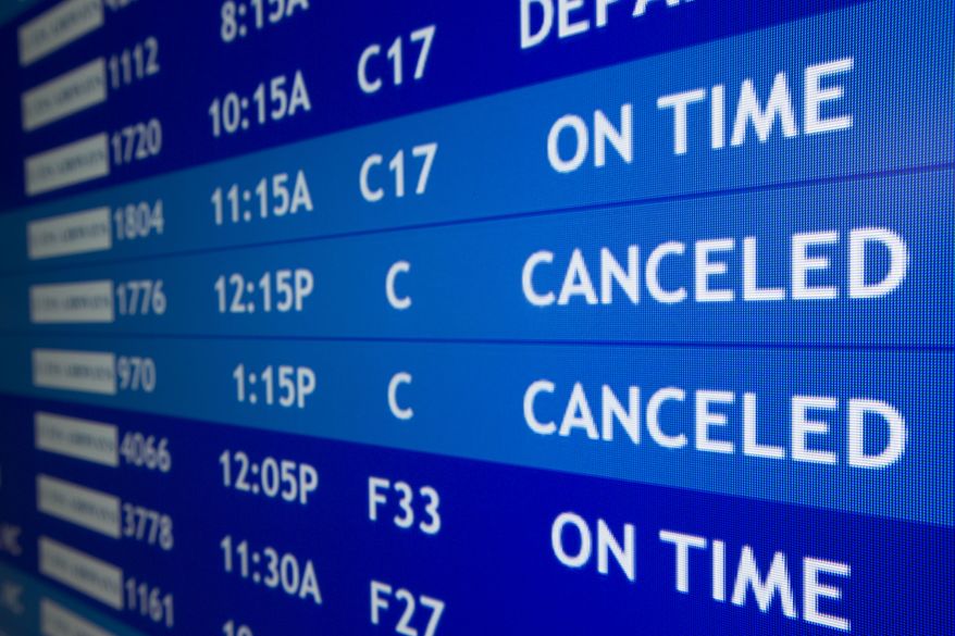 Two flights to Boston are listed as canceled at Philadelphia International Airport, Friday, Feb. 8, 2013, in Philadelphia. Airlines have already canceled more than 2,700 Friday flights as they get ready for a storm that threatens to dump up to 3 feet of snow from New York City to Boston. Flight-tracking website FlightAware shows 728 cancellations at the three big airports in the New York area. Another 191 flights to or from Boston have been scrubbed, and 137 in Toronto. (AP Photo/Matt Rourke)