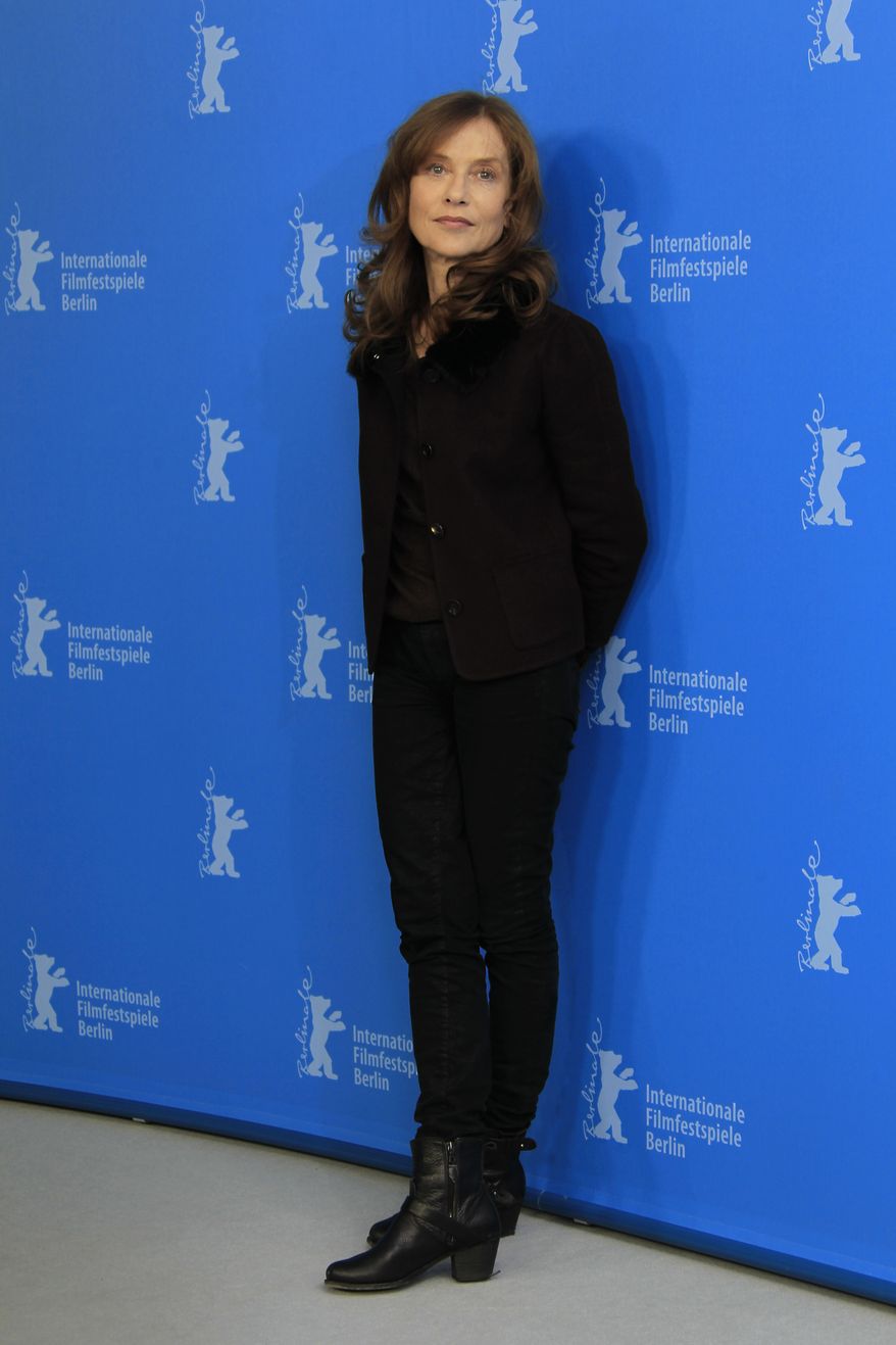 French actress Isabelle Huppert poses at the photo call for the film "The Nun" at the 63rd edition of the Berlin International Film Festival in Berlin on Sunday, Feb.10, 2013. (Joel Ryan/Invision/AP)