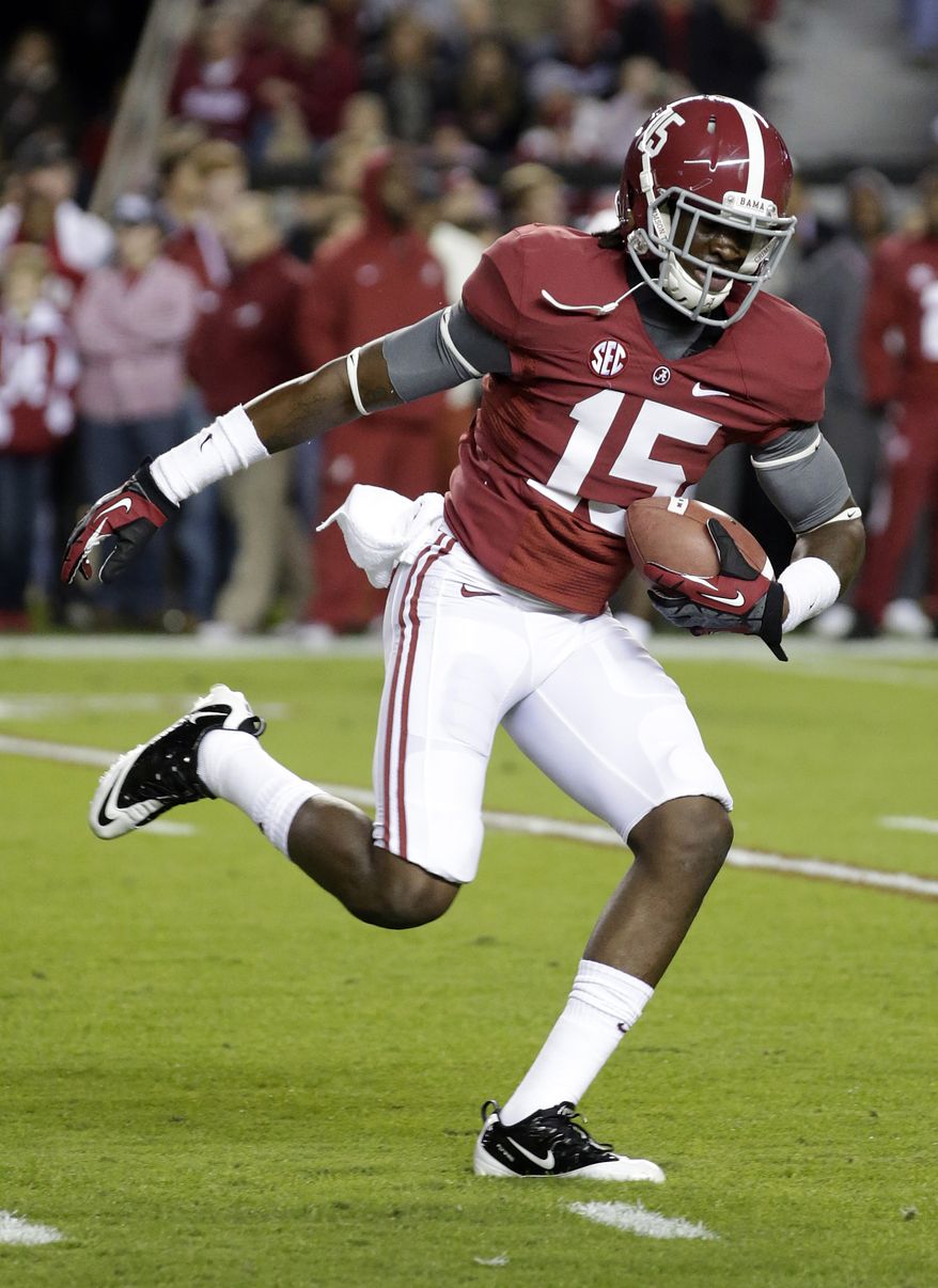 **FILE** In this Oct. 27, 2012 file photo, Alabama's Eddie Williams (15) catches a ball prior to an NCAA college football game against Mississippi State at Bryant-Denny Stadium in Tuscaloosa, Ala. Online jail records show four University of Alabama football players have been arrested on charges including credit card fraud and robbery. Records posted on the Tuscaloosa Sheriff's Department website show running back Brent Calloway was arrested Monday, Feb. 11, 2013 on a charge of fraudulent use of a credit card. Linebackers D.J. Pettway and Tyler Hayes were charged with second-degree robbery. Williams was charged with both fraudulent use of a credit card and second-degree robbery. The online records also show that Williams was arrested Sunday on a charge of carrying a pistol without a permit. (AP Photo/Dave Martin, File)