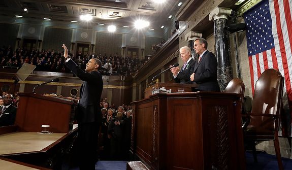 President Barack Obama waves before giving his State of the Union address during a joint session of Congress on Capitol Hill in Washington, Tuesday Feb. 12, 2013. Vice President Joe Biden and House Speaker John Boehner of Ohio stand behind the president. (AP Photo/Charles Dharapak, Pool)